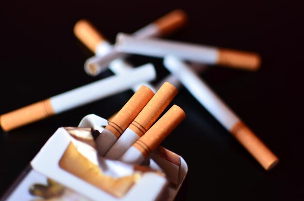 close-up-cigarettes-against-black-background_1048944-7633755